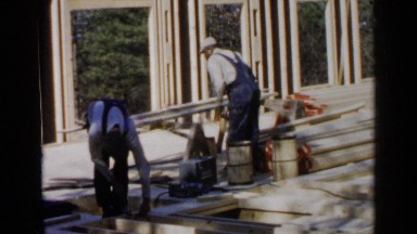 1957: some people are constructing a wooden house in the forest BIRMINGHAM