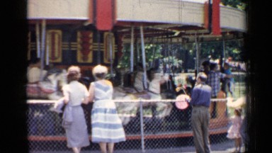 1957: people enjoying a ride in the park watched by some others CHICAGO
