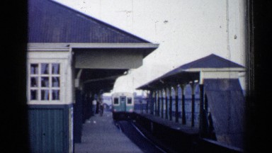 1958: video of moving trains at the old wooden train station CHICAGO