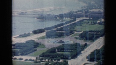 1958: view over a large fountain, wide roads, parks and the coastline