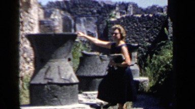1960: woman in sundress exploring ruins ROME ITALY