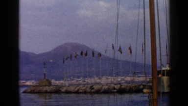 1960: a good nature background with river and all flags beside the mountain.