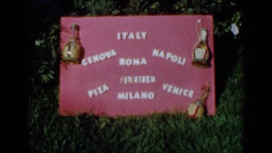 1960: red sign has white lettering spelling italy and naming popular cities