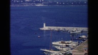 1960: overview of a large body of water with many modes of transportation