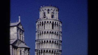 1960: the leaning tower of pisa with a daytime crowd. VENICE ITALY