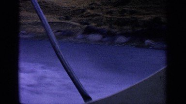 1963: a boat travel at the water fast in the forest at the sunrise time. IDAHO