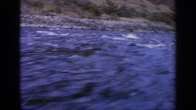 1963: a rugged coastline and waves as seen from a very fast moving vessel IDAHO