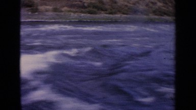 1963: water flowing fastly in the river and water is scattering IDAHO