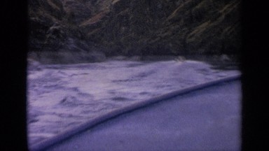 1963: looking out from boat while it moves, other boat in the distance, water