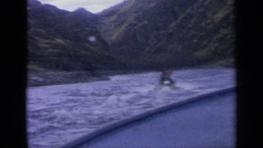 1963: the two persons are getting boat ride on the river IDAHO