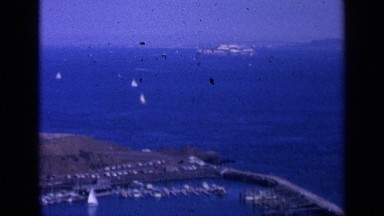 1963: aerial view of sailboats making their way back to shore. SAN FRANCISCO