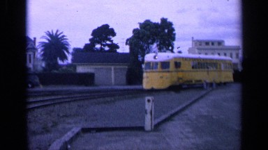 1963: a yellow and white train car approaching on the tracks SAN FRANCISCO