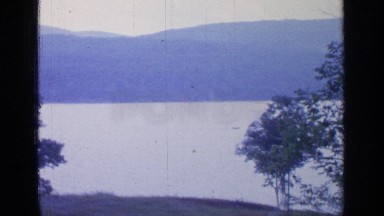 1964: a very nice landscape of a mountain with a small lake in the way GREENWOOD