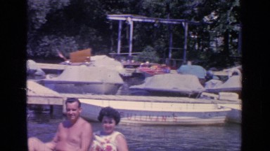 1964: couple takes a ride on a paddle boat on a lake GREENWOOD LAKE NEW YORK