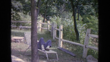 1964: the man laydown on the table in the beautiful garden GREENWOOD LAKE