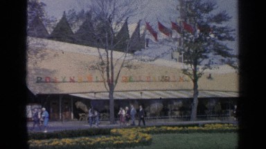 1964: people are walking on the streets, famous building WORLDS FAIR NEW YORK