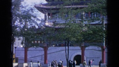 1964: a tourist place of a holy temple with many tourist as visitors in gang