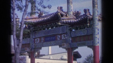 1964: people looking at a chinese building, the building looks three stories