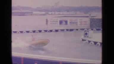 1964: two men riding in a motor boat WORLDS FAIR NEW YORK