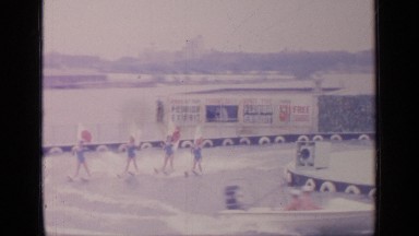 1964: people are performing certain tasks in water, people are watching