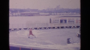 1964: man water-skis while being pulled round a water track by a boat