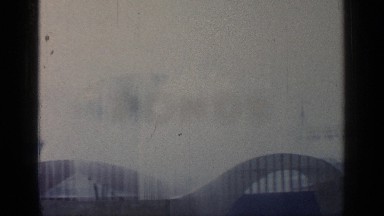 1964: a beautiful video of a seascape and fountains and an american flag