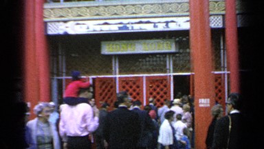 1964: the peoples are crossing and standing in front of the restaurant