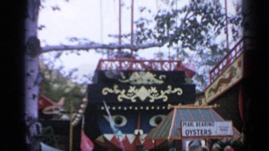 1964: thousands of people are walking and talking at the amusement park