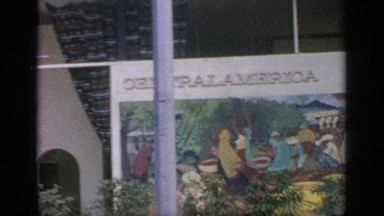 1964: pedestrians walk around exterior of a famous foreign building.