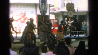 1964: tribal people performing a spectacular dance on street side