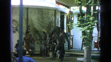 1964: a traditional tribal display is shown; drums are beaten, and men