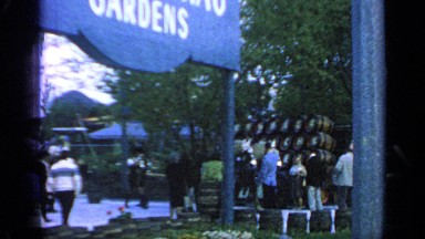 1964: these people are walking behind horses while they hold onto them