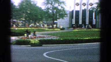 1964: people walking outside on a sunny day. WORLDS FAIR NEW YORK