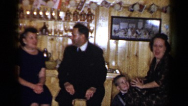 1965: friends gather around an in-home bar. LONG ISLAND NEW YORK