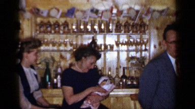 1965: family and friends are enjoy the party in the bar at the evening time