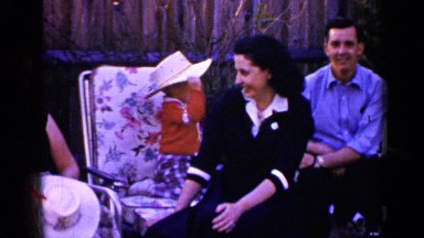 1965: a family sitting outside on lawn chairs LONG ISLAND NEW YORK