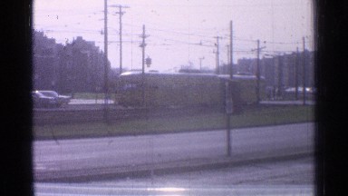 1965: a view of a bus passing through a town OHIO