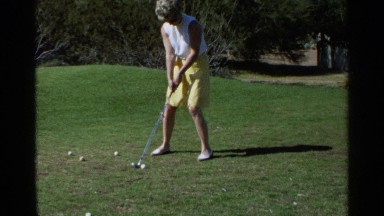 1968: Slow Motion Footage of Woman in Yellow Shorts Hitting a Golf Ball