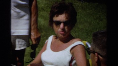 1968: party of adults gathered around table outside, summertime SCOTTSDALE