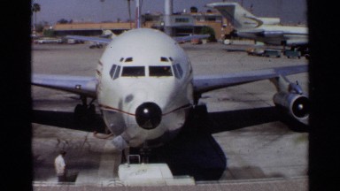1968: footage shows commercial aeroplane before zooming into cockpit. SCOTTSDALE