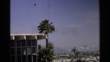 1968: a popular building and its beautiful and very tall palm trees SCOTTSDALE