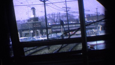 1976: a travel by an ancient train through an industrial neighborhood ILLINOIS