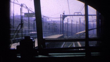 1976: what appears to be a train moving down the tracks as seen from inside