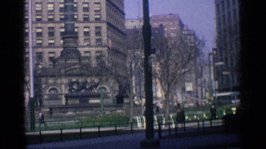 1976: camera pans along a busy city street. ILLINOIS CHICAGO