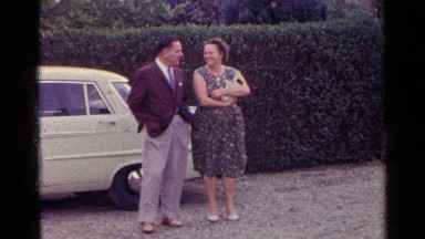 1961: People Standing Near Car in Germany