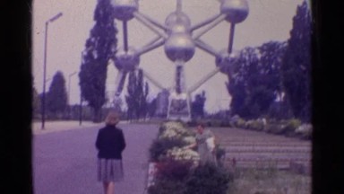 1961: two women meeting at a fair, one holding a jacket the other a purse PARIS