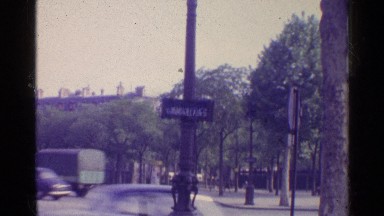 1961: car and transports are moving at the city road at the morning time