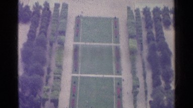 1961: an aerial view of a palatial manor is shown with large buildings