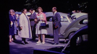 1961: Well-Dressed Crowd Gatherings at a Parking Lot in Switzerland