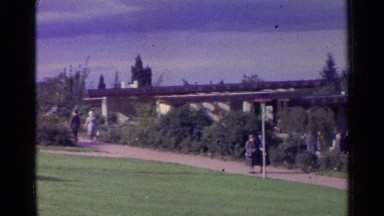 1961: People Walking Along a Scenic Pathway in Switzerland